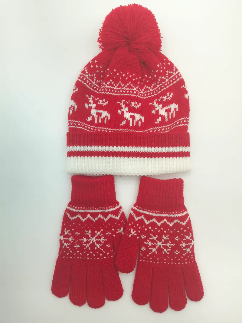 Rote und weiße Fair-Isle-Strickmütze mit Bommel und dazu passende Handschuhe mit Rentier-Muster im Set
